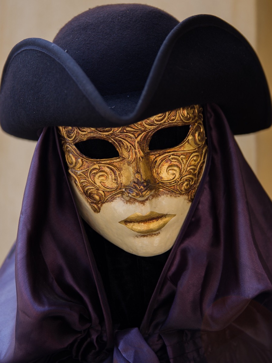 Venetian carnival costume with mask and hat